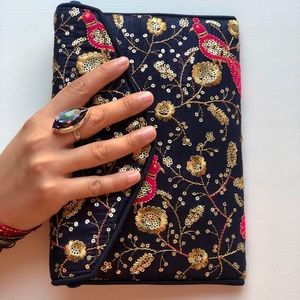 Hand embroidered clutch